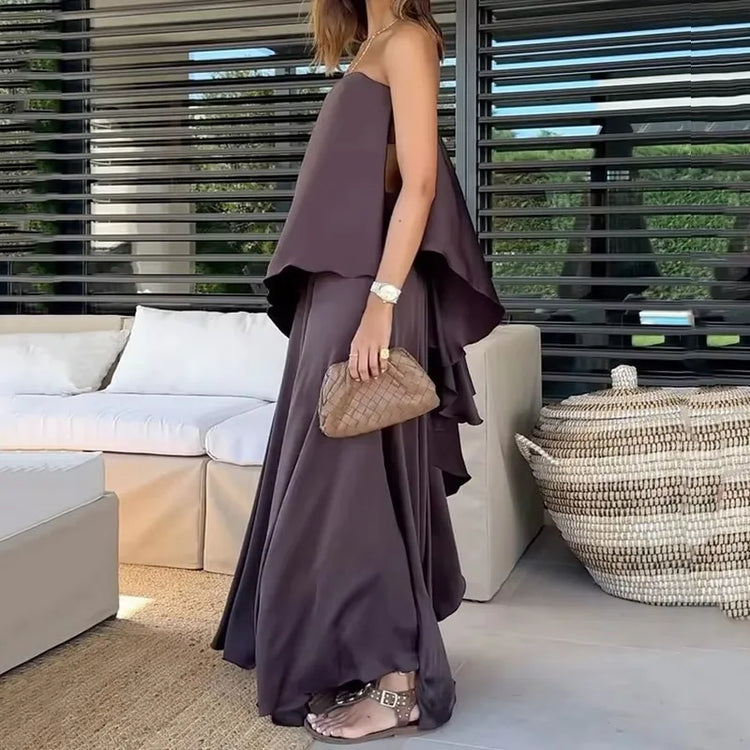 Trendy women's off-shoulder top and elegant maxi skirt two-piece set, offering sophisticated summer style.