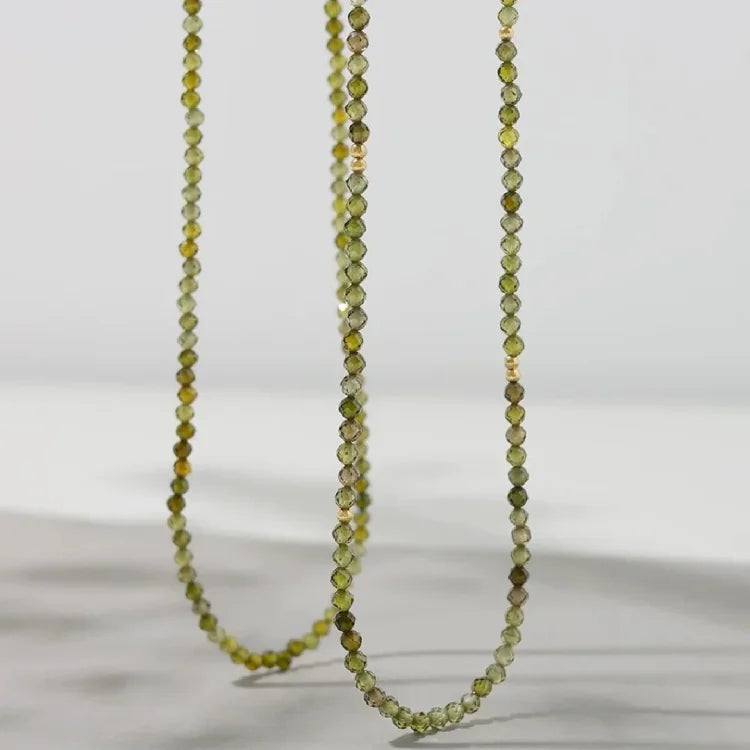 Chic gold-plated sterling silver necklace with a stunning olive green zirconia pendant for women.
