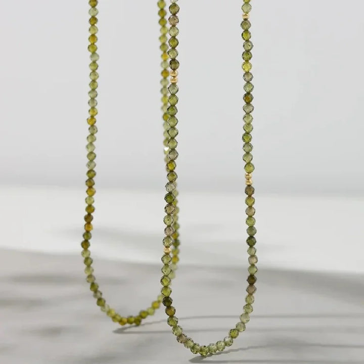 Chic gold-plated sterling silver necklace with a stunning olive green zirconia pendant for women.