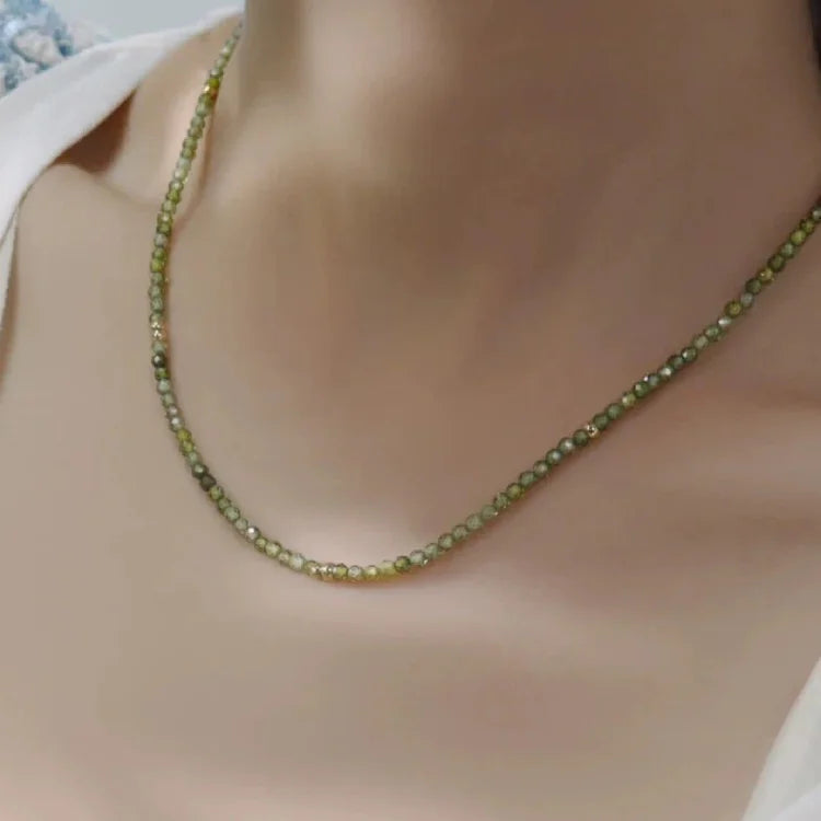 Fashionable olive green zirconia necklace, ideal women's jewelry. Gold-plated and elegant.