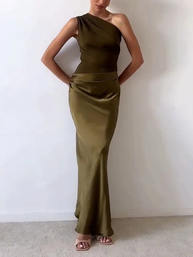 Floor-length women's one shoulder maxi dress with a flattering ruched waist & elegant bias cut, ideal for formal events.