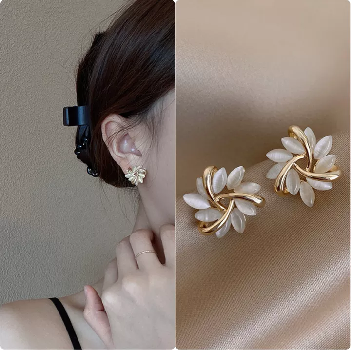 Women's elegant jewelry: beautiful opal petal stud earrings with a delicate floral look.