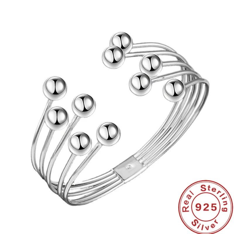 Elegant women's open cuff bracelet with sleek silver beads. Adjustable, modern fashion accessory for her.