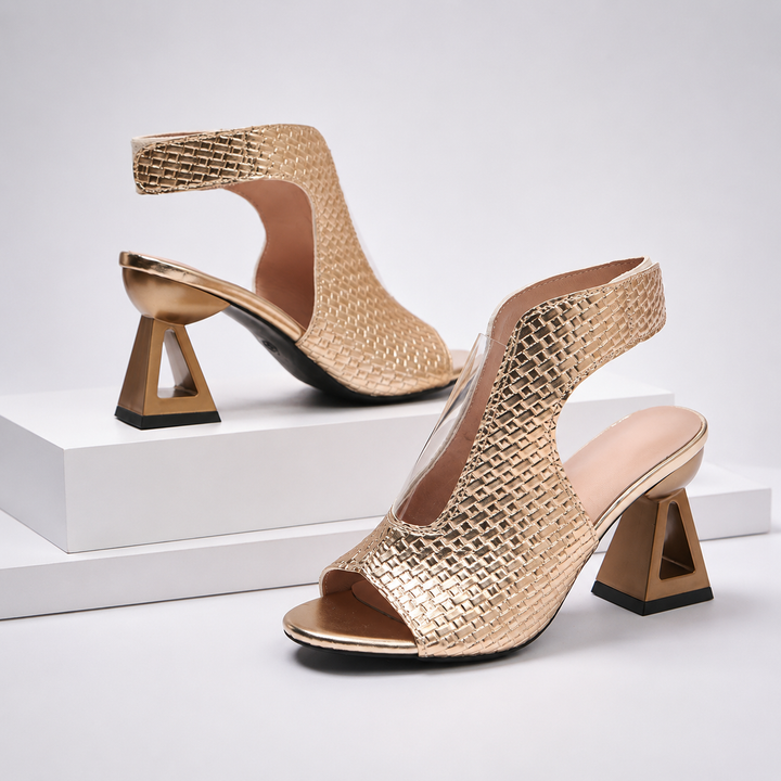 Fashionable women's open-toe heels with an elegant pattern, modern geometric heel, and chic slingback. Party footwear.