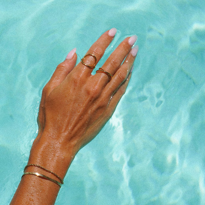 Detailed view of a women's minimalist silver oval ring, perfect for daily wear.