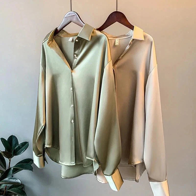 Elegant women's oversized button-up shirt with long sleeves, perfect for office or casual chic wear.