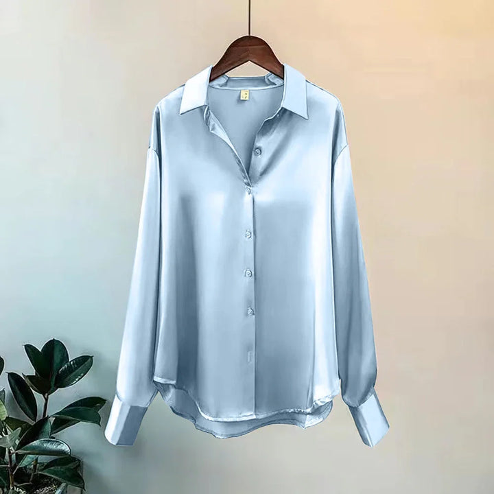 Stylish green oversized button-up shirt for women, a versatile long-sleeve top for various occasions.