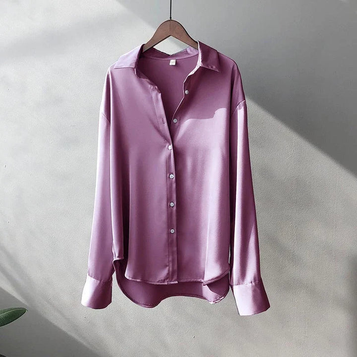 Chic purple women's oversized button-up shirt, an elegant long-sleeve fashion top for evening or office.
