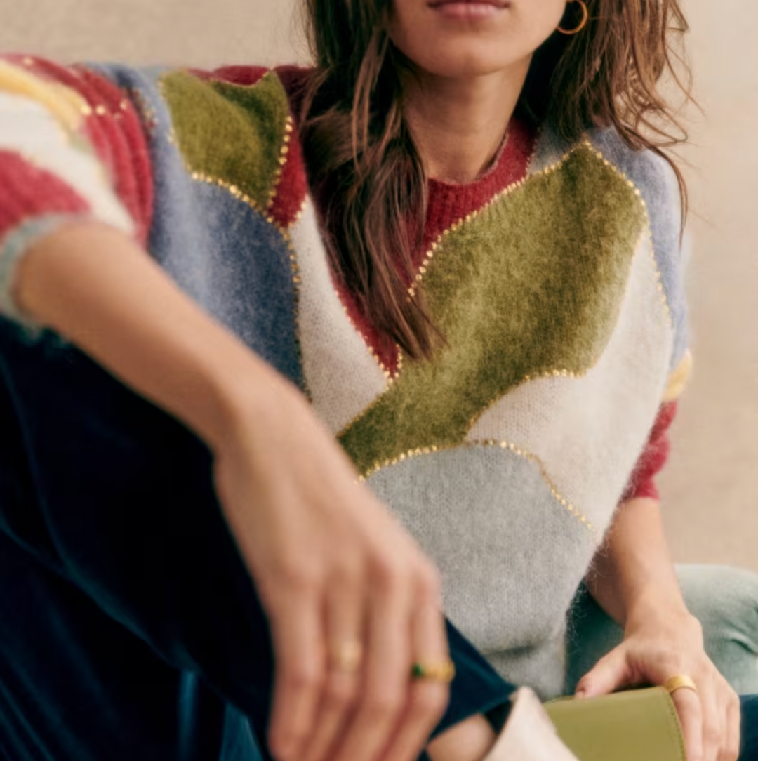 New arrival: Women's textured patchwork crewneck sweater with elegant gold accents, a versatile fall top.