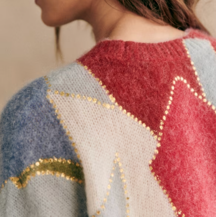 Chic women's long sleeve crewneck sweater, featuring a unique patchwork design, great for fall & winter fashion.