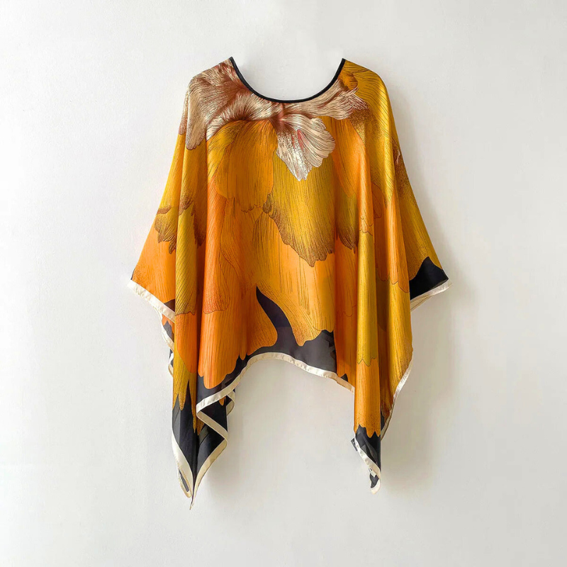Elegant women's patterned shawl. Stylish accessory, perfect for spring/summer fashion & chic layering.