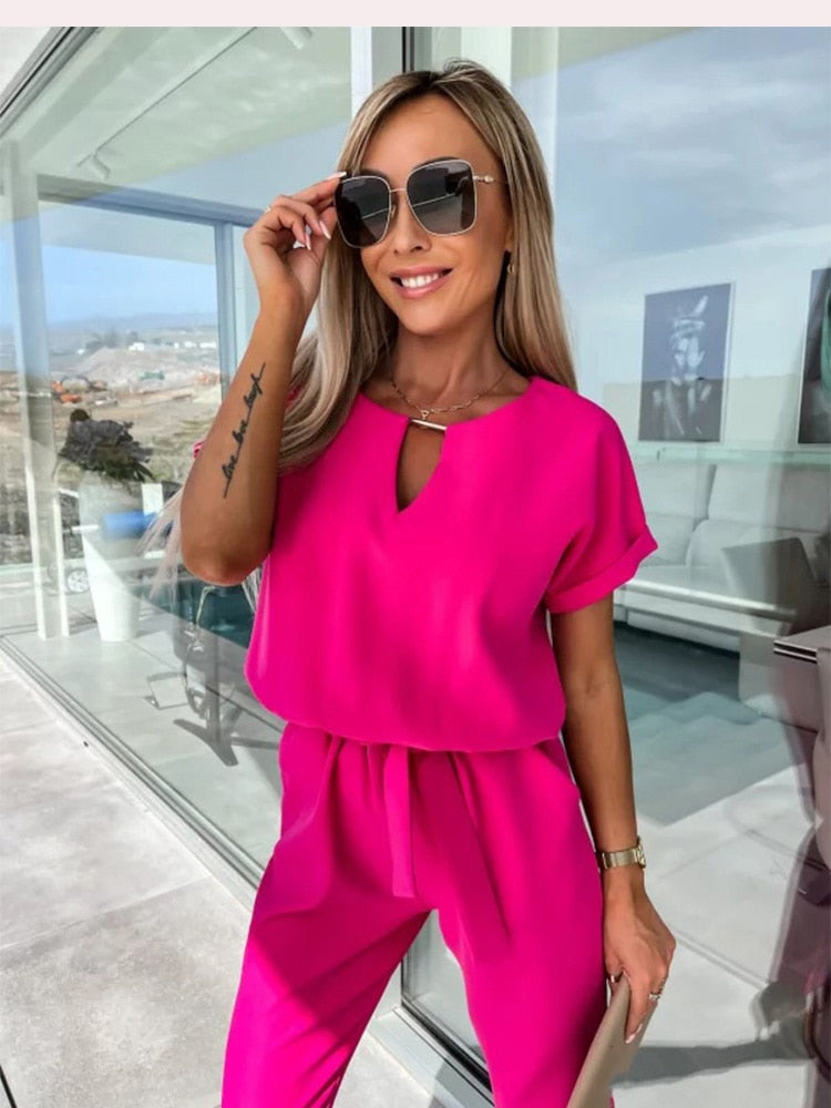 Stylish women's Patty jumpsuit, elegant wide leg & V-neck design. Versatile and comfortable for any occasion.