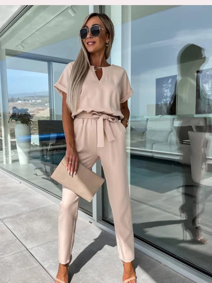 Fashionable women's Patty jumpsuit with a chic wide leg and V-neck, offering elegant & versatile style.