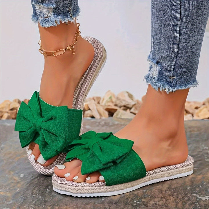 Ladies fashion pearl bow slide sandals, offering comfortable open-toe style for daily wear & summer outfits.