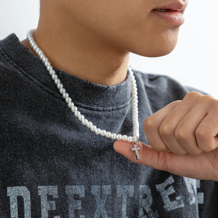 Delicate pearl cross necklace with shimmering pearls & an adjustable chain, a beautiful women's accessory.