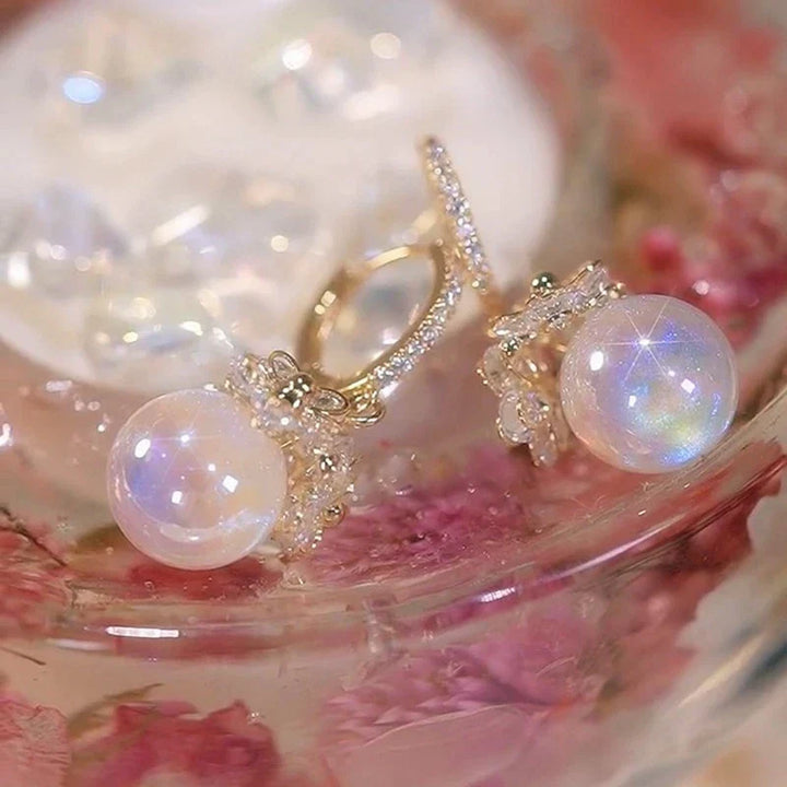 Classic women's pearl drop earrings with lustrous freshwater pearls, ideal for elegant timeless jewelry looks.