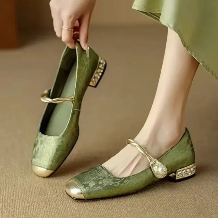 Stylish black women's pearl flats, ideal for office, daily & elegant dress wear.
