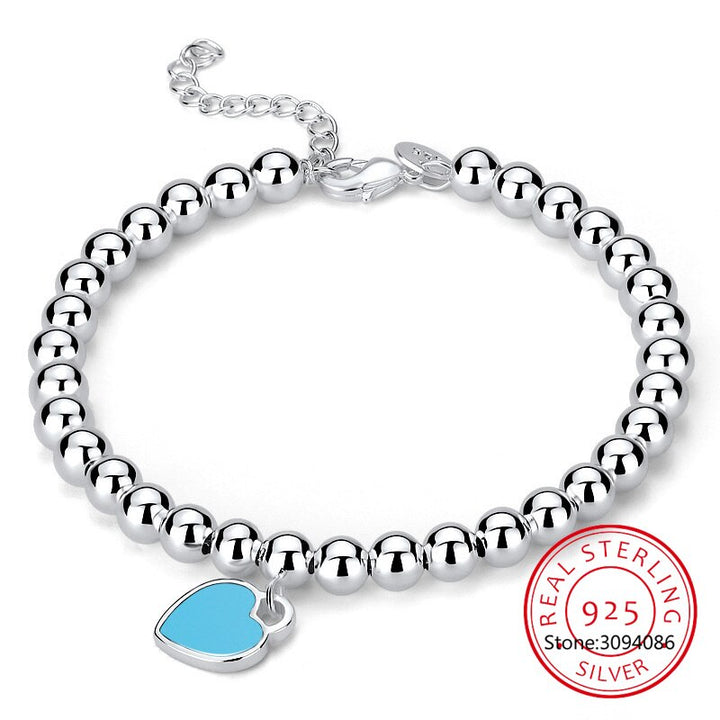 Adjustable pearl heart bracelet for women, featuring blue pearls and an elegant design, ideal as romantic gemstone jewelry.