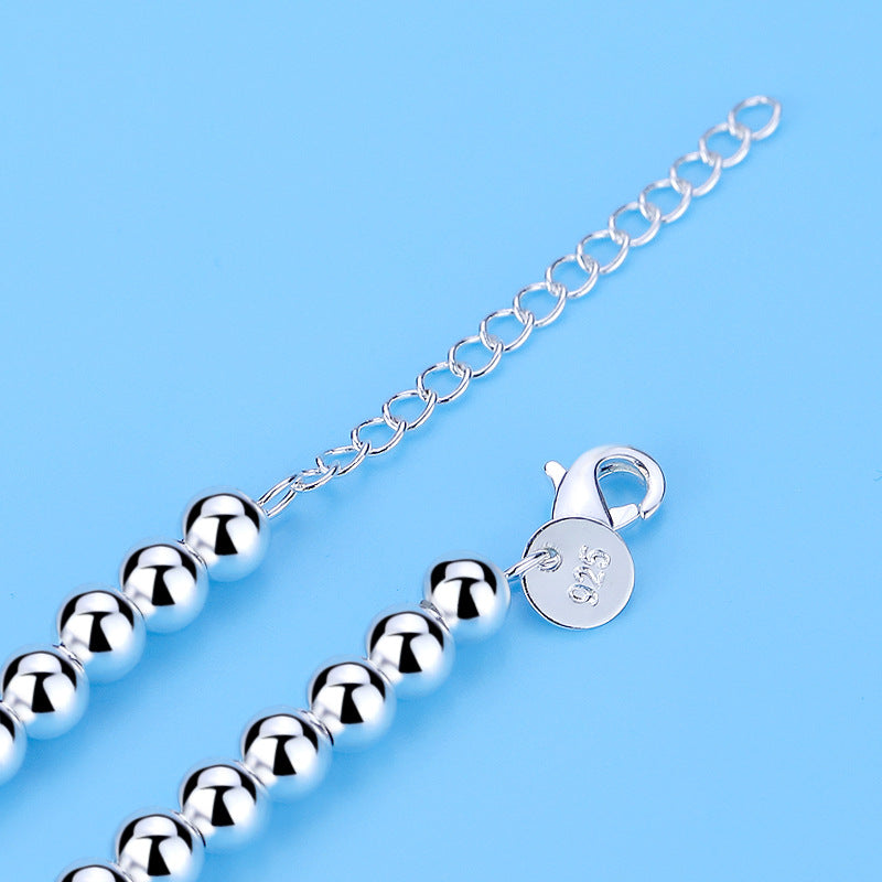 Sophisticated women's pearl heart bracelet, a romantic and elegant fashion accessory with beautiful blue pearls.