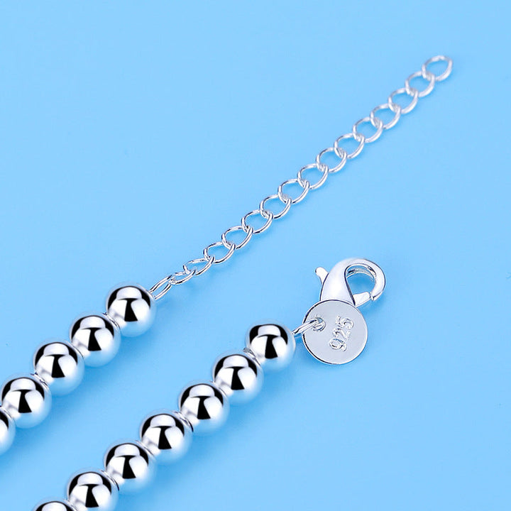Sophisticated women's pearl heart bracelet, a romantic and elegant fashion accessory with beautiful blue pearls.