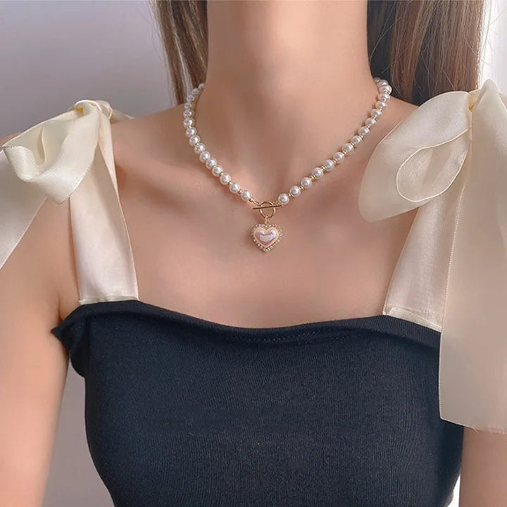 Elegant women's pearl necklace with a secure clasp, perfect as a classic timeless fine jewelry accessory.