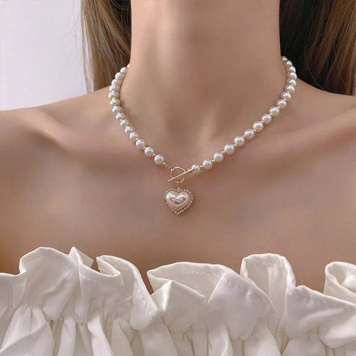 Beautiful women's elegant pearl necklace featuring classic pearls and a secure lobster clasp, ideal neckwear.