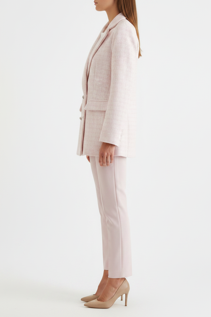Close-up of a vibrant pink women's tailored blazer, an elegant jacket for business and smart casual events.