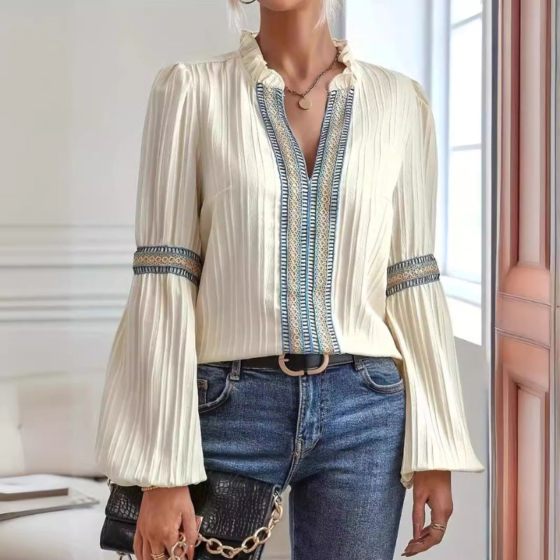 Elegant women's pleated blouse featuring delicate lace trim, perfect for stylish workwear or casual fashion.