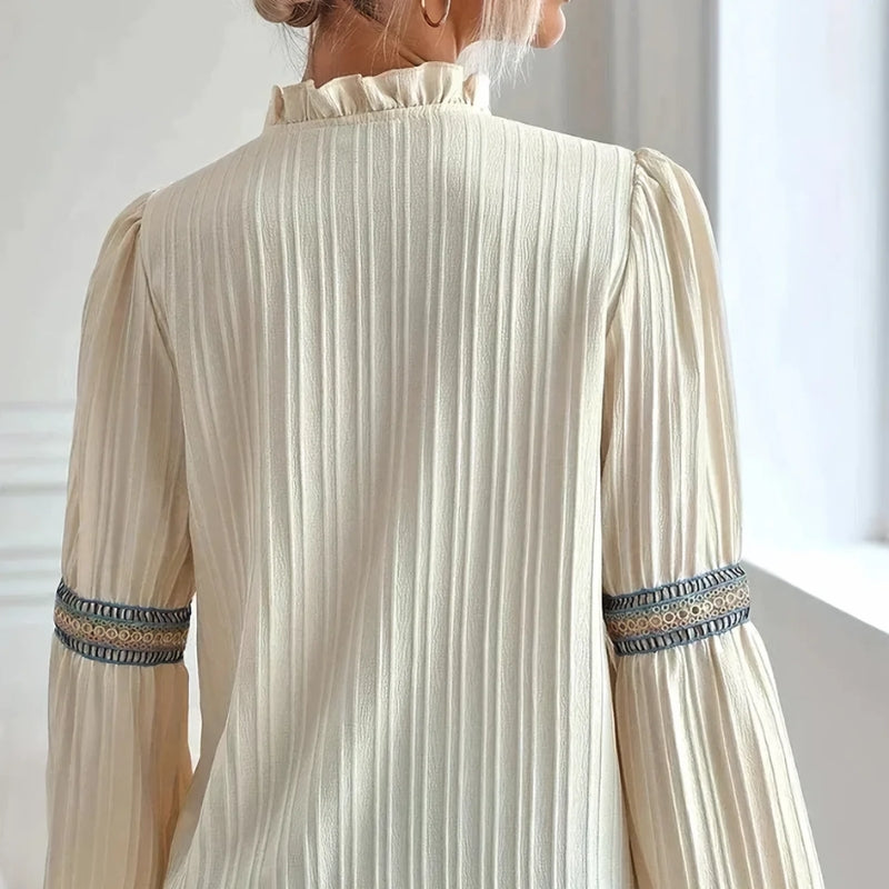 Versatile ladies pleated top with exquisite lace trim, ideal for an elegant workwear look or chic casual wear.
