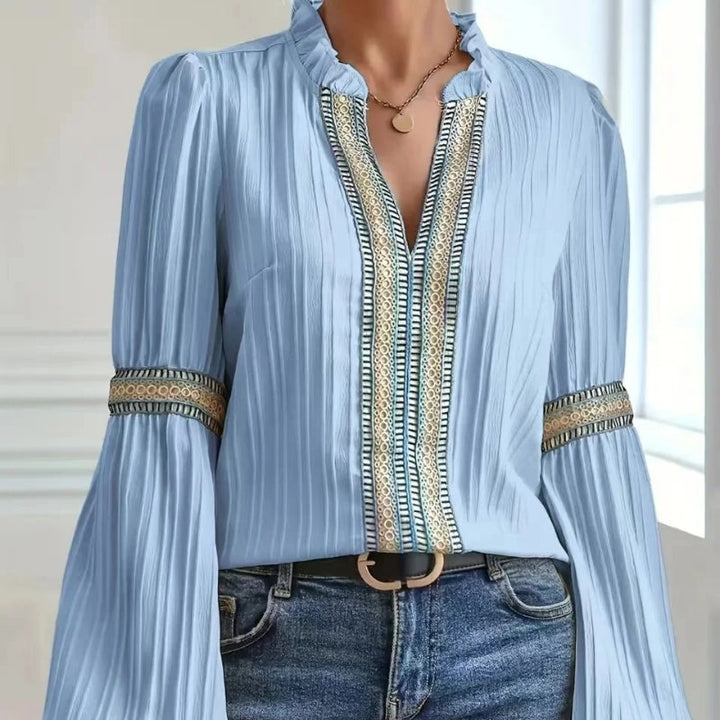 Chic women's blouse: elegant pleated design, delicate lace trim, and fashionable fluted sleeves. Perfect ladies top.