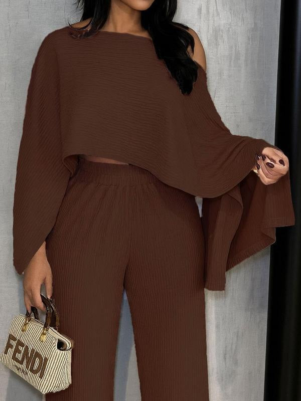 Chic women's pleated two-piece set: elegant one-shoulder chiffon top & flowing wide-leg pants. Perfect for summer resort wear.