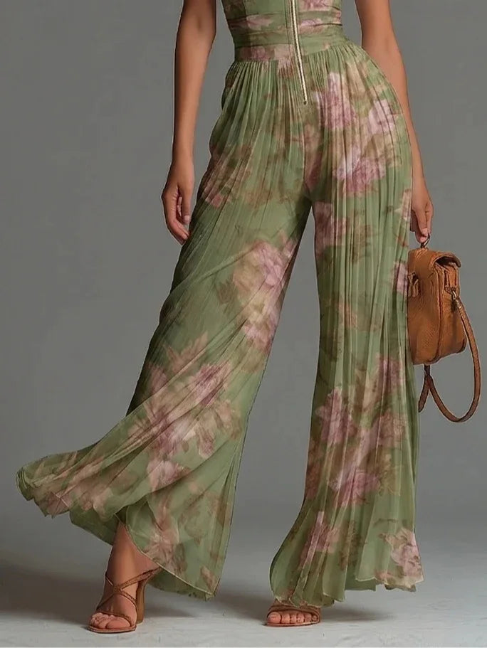 Women's vibrant floral halter neck jumpsuit featuring stylish pleats and a comfortable wide-leg design. Summer chic.