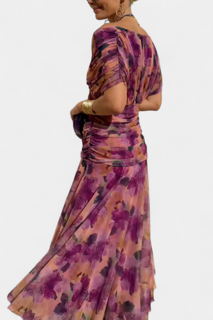 Formal women's maxi dress featuring a pleated waist and V-neck, ideal for wedding guests.