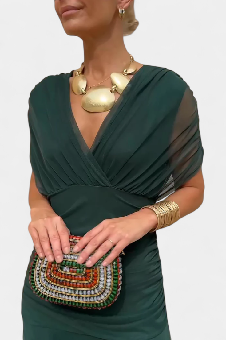 Pleated maxi dress for women, an elegant V-neck formal gown suitable for wedding guests.