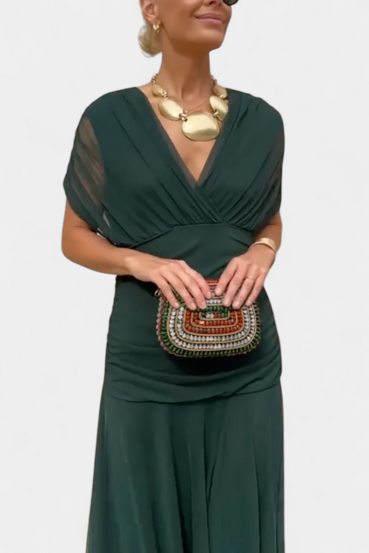 Women's elegant evening dress: a sleeveless pleated maxi gown, perfect for formal occasions.