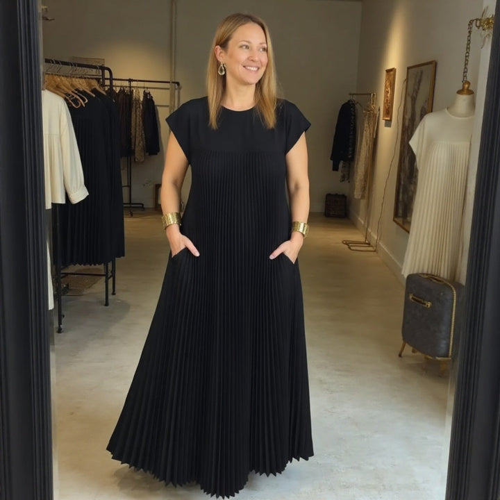 Women's elegant pleated maxi dress, with a flowing design for ultimate comfort & style.
