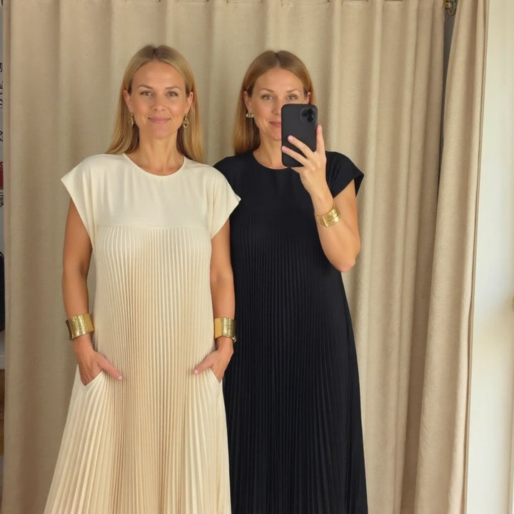 Versatile women's pleated maxi dress, offering an elegant, flowing silhouette for various occasions.