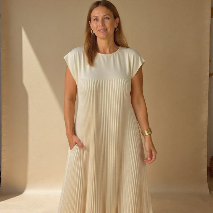 Elegant long pleated dress for women, offering a flowing & comfortable style for diverse events.