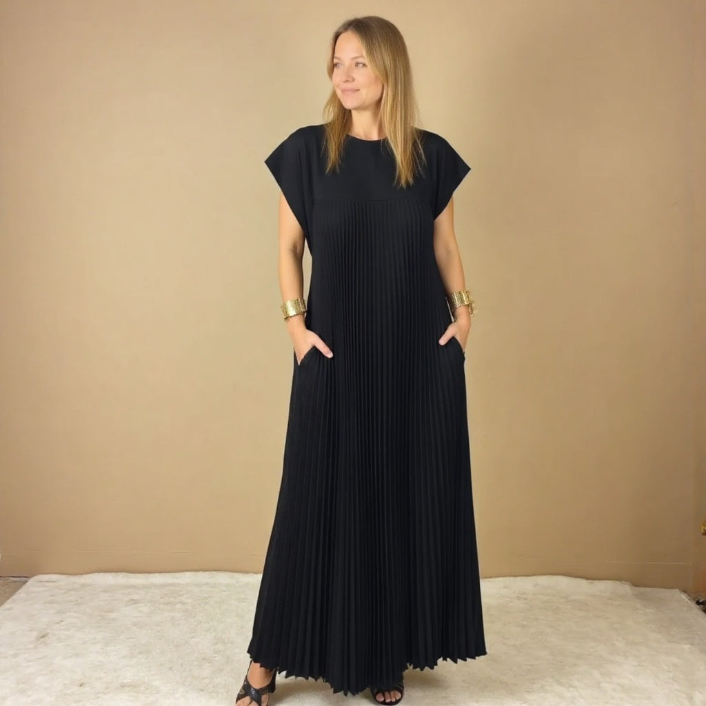 Women's flowing pleated maxi dress, a versatile piece for effortless casual elegance.