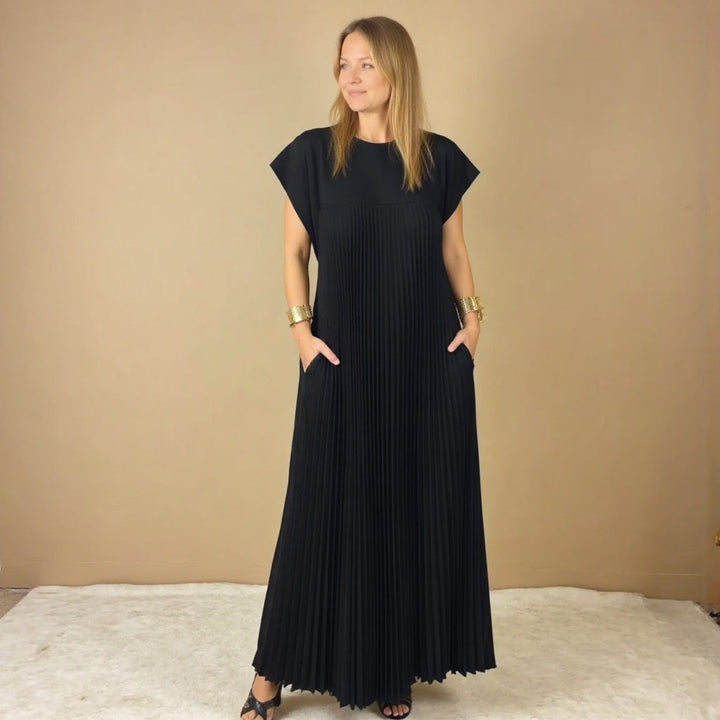 Women's flowing pleated maxi dress, a versatile piece for effortless casual elegance.