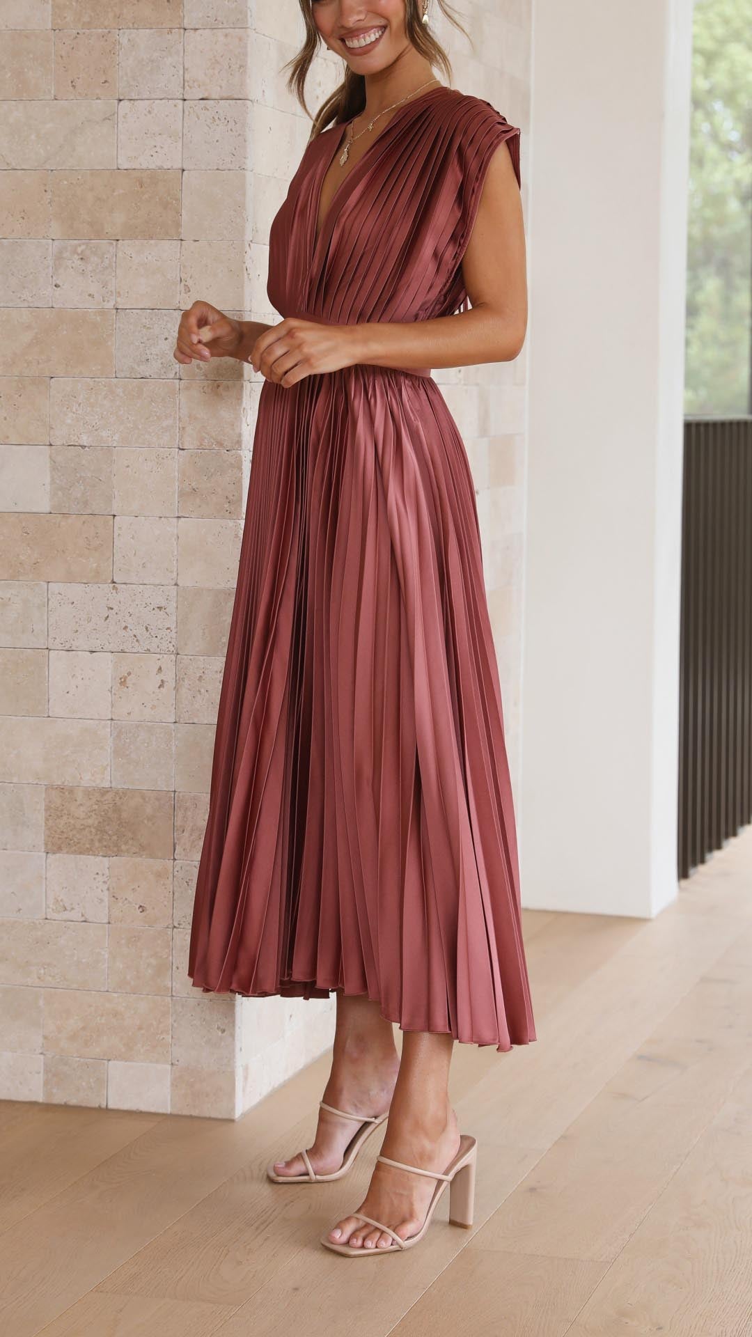 Stylish sleeveless pleated maxi dress for women, deep V-neck, great for formal events.