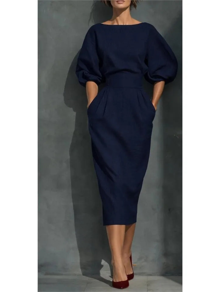 Versatile women's midi dress, perfect for office wear or cocktail events, with elegant pleats and trendy lantern sleeves.