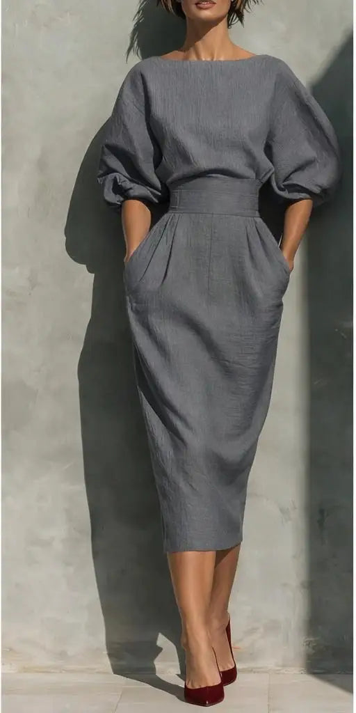 Sophisticated women's midi dress, featuring a pleated design, elegant lantern sleeves, and a cinched waist. Great for fashion.