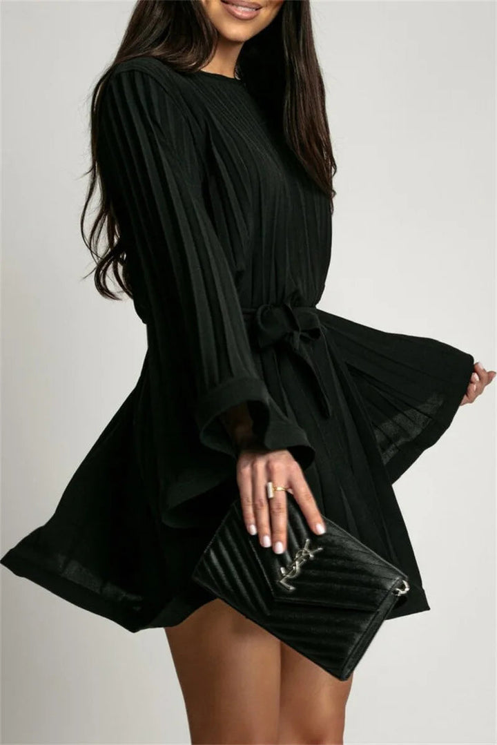 Graceful women's pleated mini cocktail dress with elegant flared sleeves. A must-have for evening fashion.