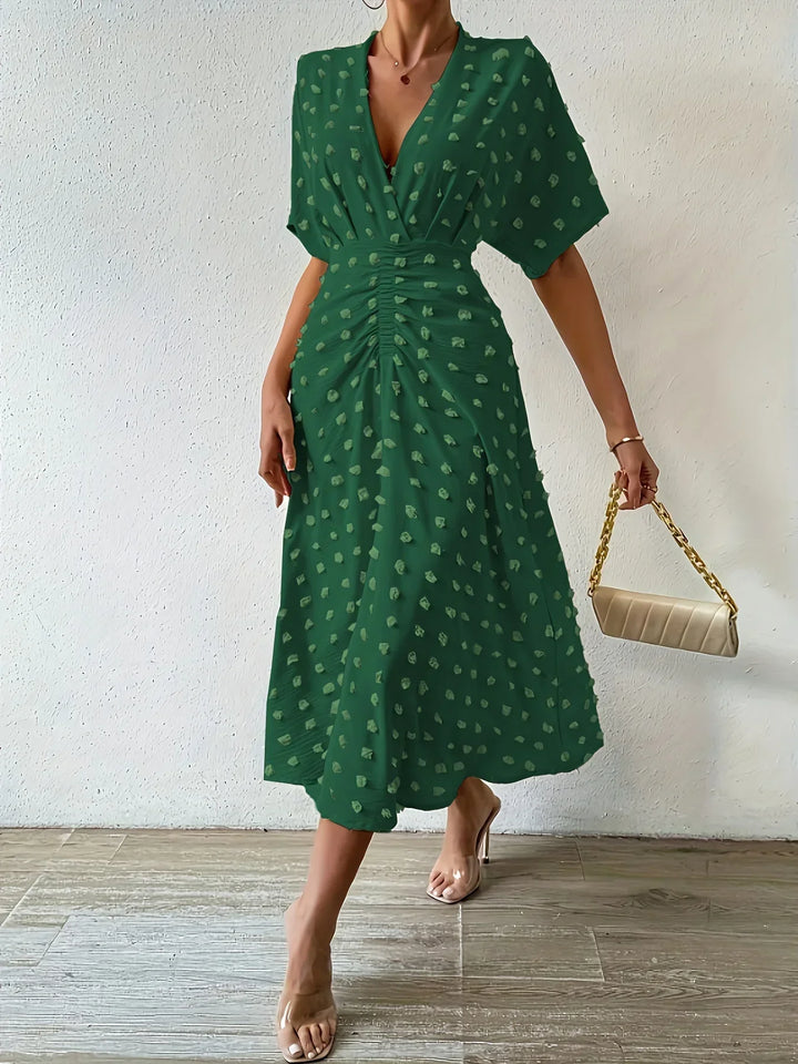 Sophisticated women's pleated midi dress, featuring elegant ruffles & a flattering silhouette.