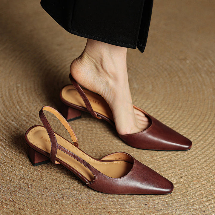 Versatile beige pointed toe slip-on heels for women. Classic, comfortable work or dress shoes.