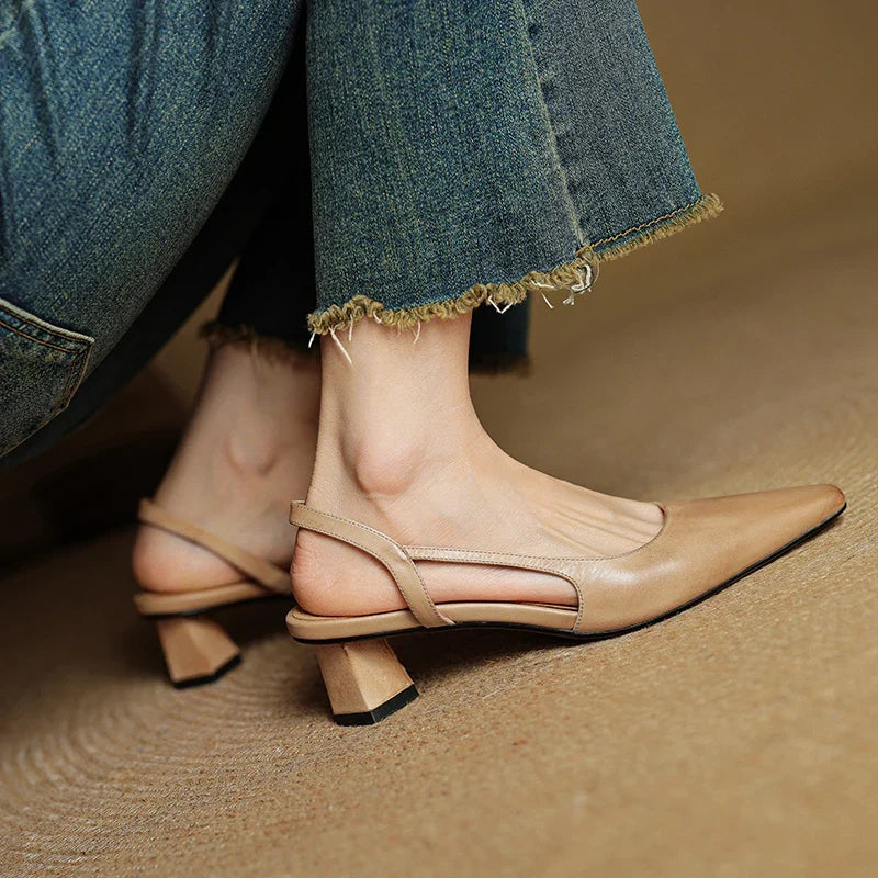 Close-up of sleek pointed toe on elegant women's heels. Perfect classic dress shoe design.