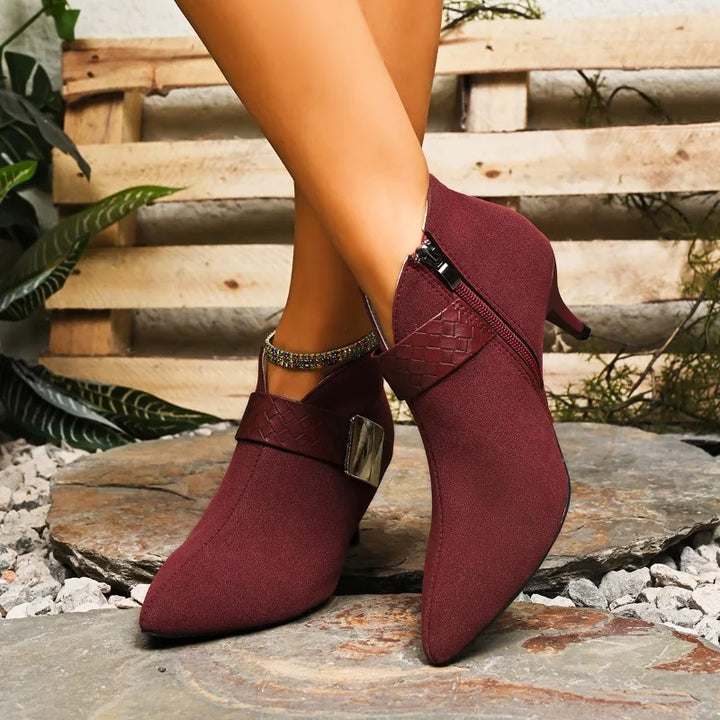 Elegant pointed toe heels, comfortable dress shoes with a metallic buckle detail.