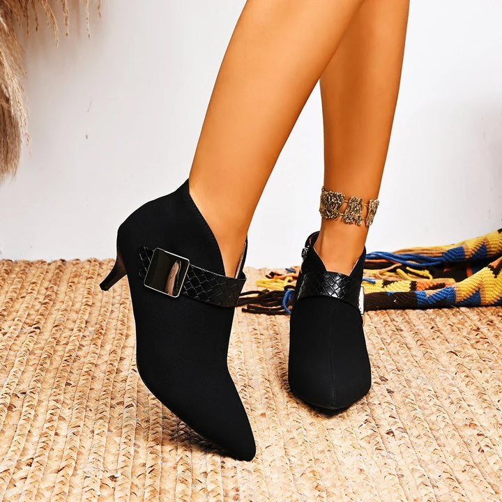 Elegant women's pointed toe heels with a metallic buckle and slim heel.