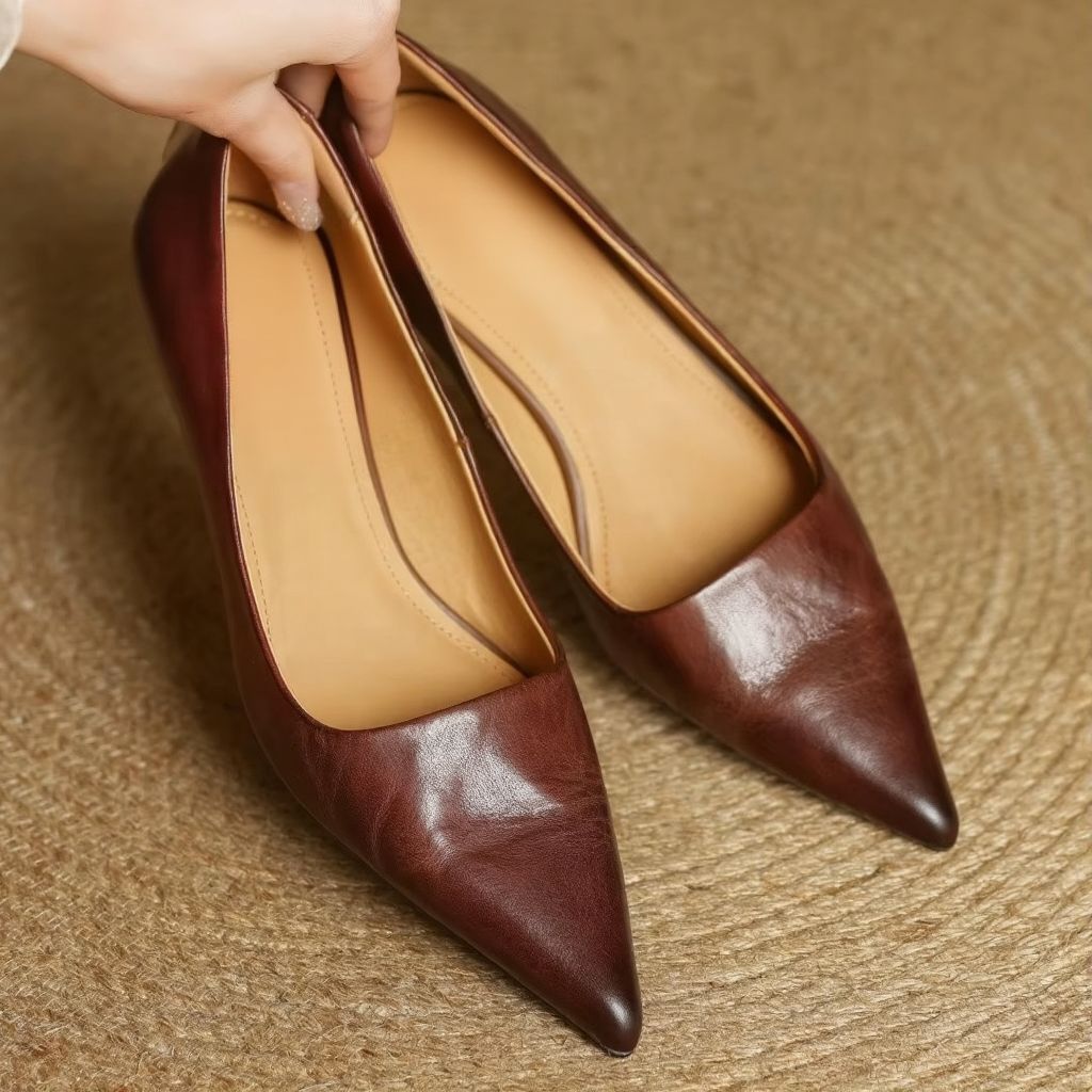 Khaki women's pointed-toe pumps with a sleek thin heel, ideal elegant work footwear.